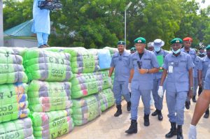 Comptroller of Customs, Kebbi State Area Command, Mr Iheanacho Ernest Ojike displaying seized second hand cloths at the command's headquarters Birnin Kebbi.